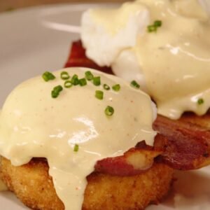 Eggs Benedict with potatoes or grits