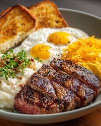 Steak & 2 Eggs with grits or potatoes, toast & butter