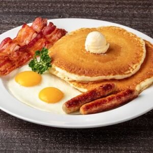 Two eggs with bacon or sausage + Hot Cakes